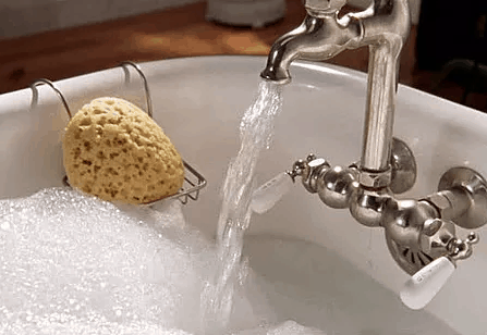 Hot water flowing into a bathtub from newly installed plumbing and hot water heater Hot water flowing into a bathtub from newly installed plumbing and hot water heater