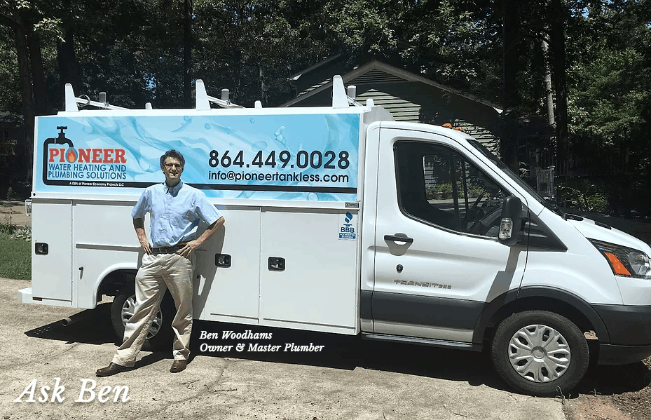 Professional plumber Benjamin Woodhams standing with his plumbing work truck from which he does new plumbing and water heater installations and repairs Professional plumber Benjamin Woodhams standing with his plumbing work truck from which he does new plumbing and water heater installations and repairs