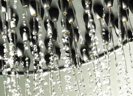 Hot water dripping into a shower from a tankless water heater and newly installed plumbing Hot water dripping into a shower from a tankless water heater and newly installed plumbing